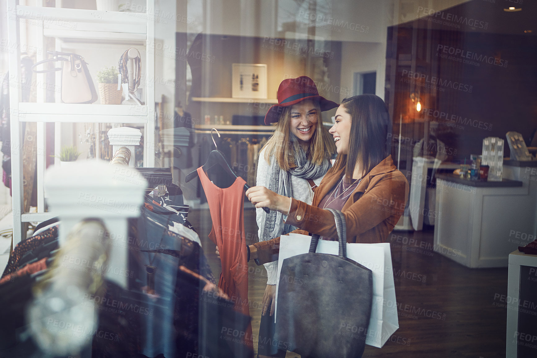 Buy stock photo Customer, happy and women with dress in boutique shop for promotion, discount and sale. Smile, female friends and people checking rack of clothes in fabric, fashion and retail store at indoor mall