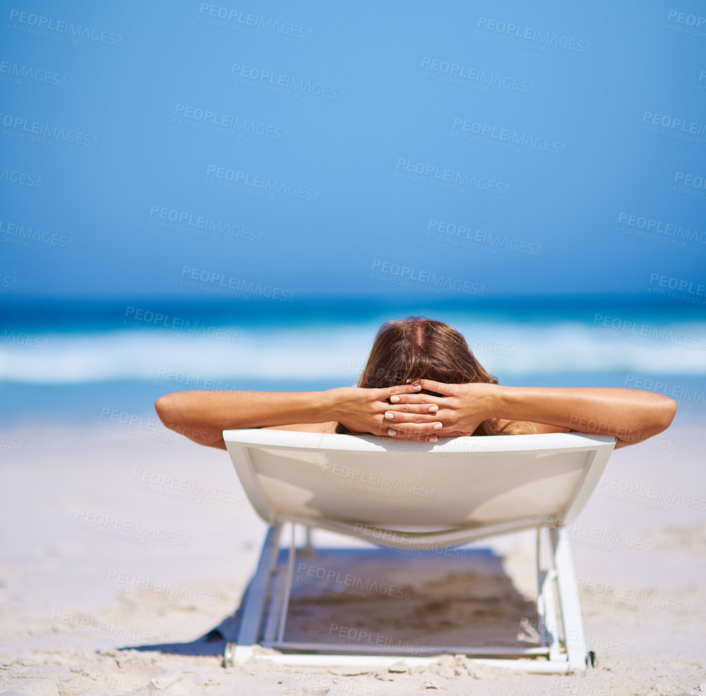 Buy stock photo Back view, woman and relax on chair at beach for adventure, holiday or sunshine at tropical resort in Maldives. Female person, island and travel on vacation, peace or blue sky for sunbathing