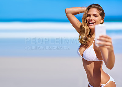 Buy stock photo Shot of an attractive young woman enjoying a vacation at the beach