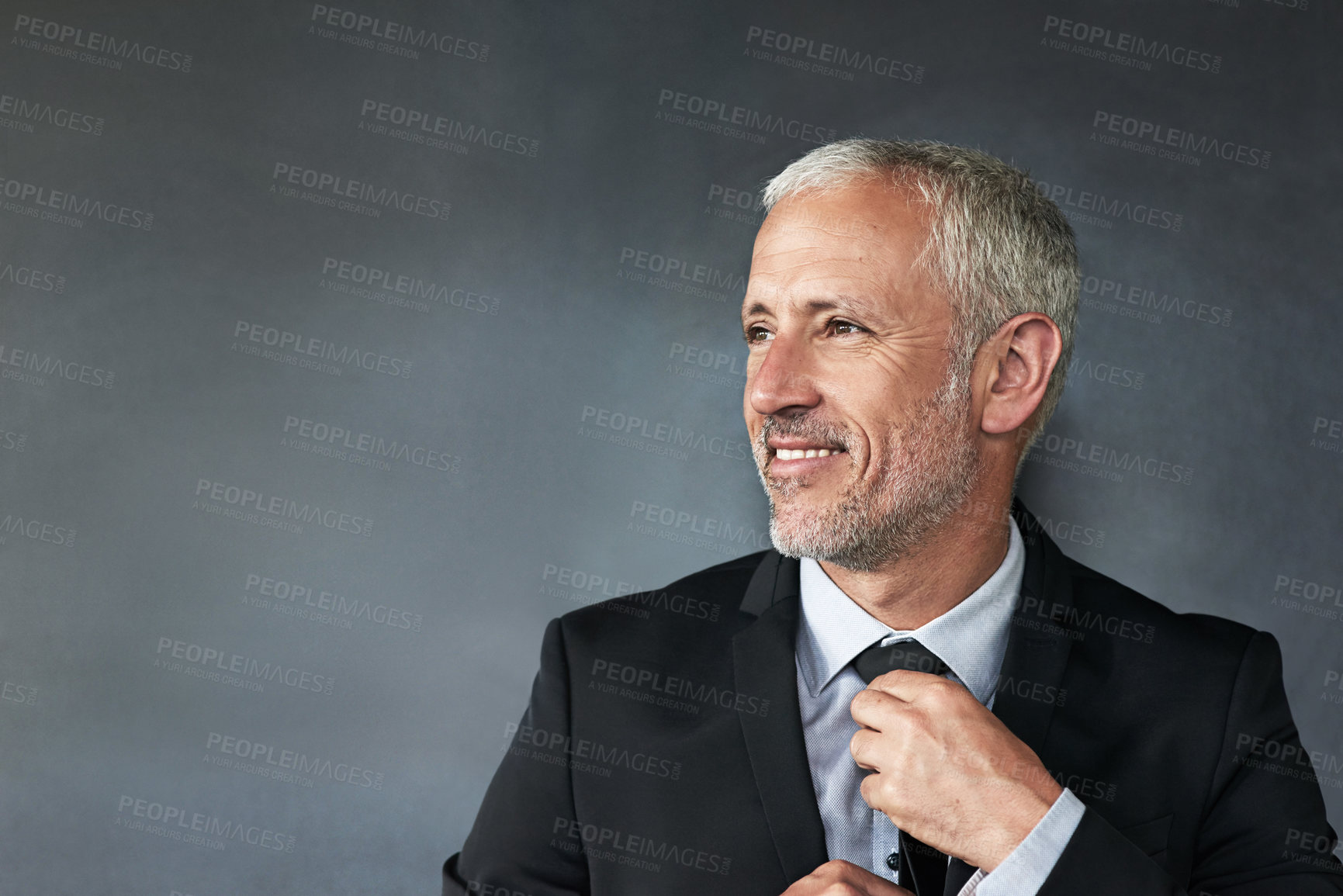 Buy stock photo Cropped shot of a handsome mature businessman in corporate attire