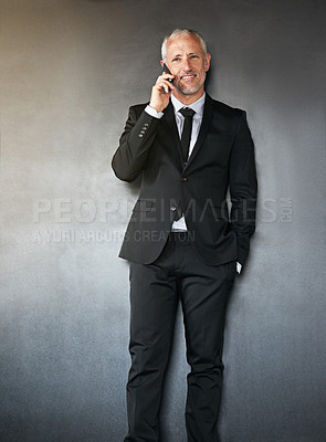Buy stock photo Businessman, phone call and happy for communication, contact and network in studio. A senior entrepreneur person on a grey background with a smartphone for conversation about corporate connection