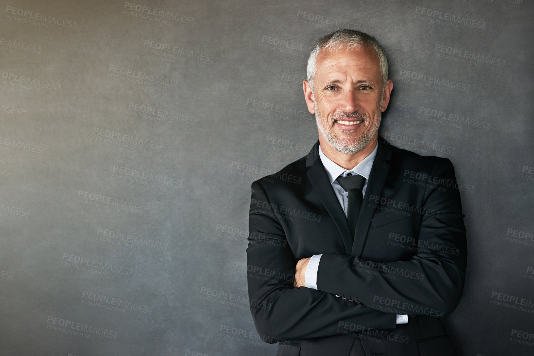 Buy stock photo Cropped shot of a handsome mature businessman in corporate attire