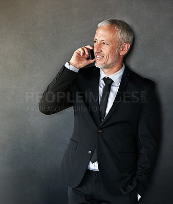 Buy stock photo Thinking, happy and businessman on a phone call for communication, contact and network in studio. Senior entrepreneur person on grey background with a smartphone for conversation, mockup or idea