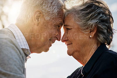 Buy stock photo Shot of a happy senior couple spending time together outdoors