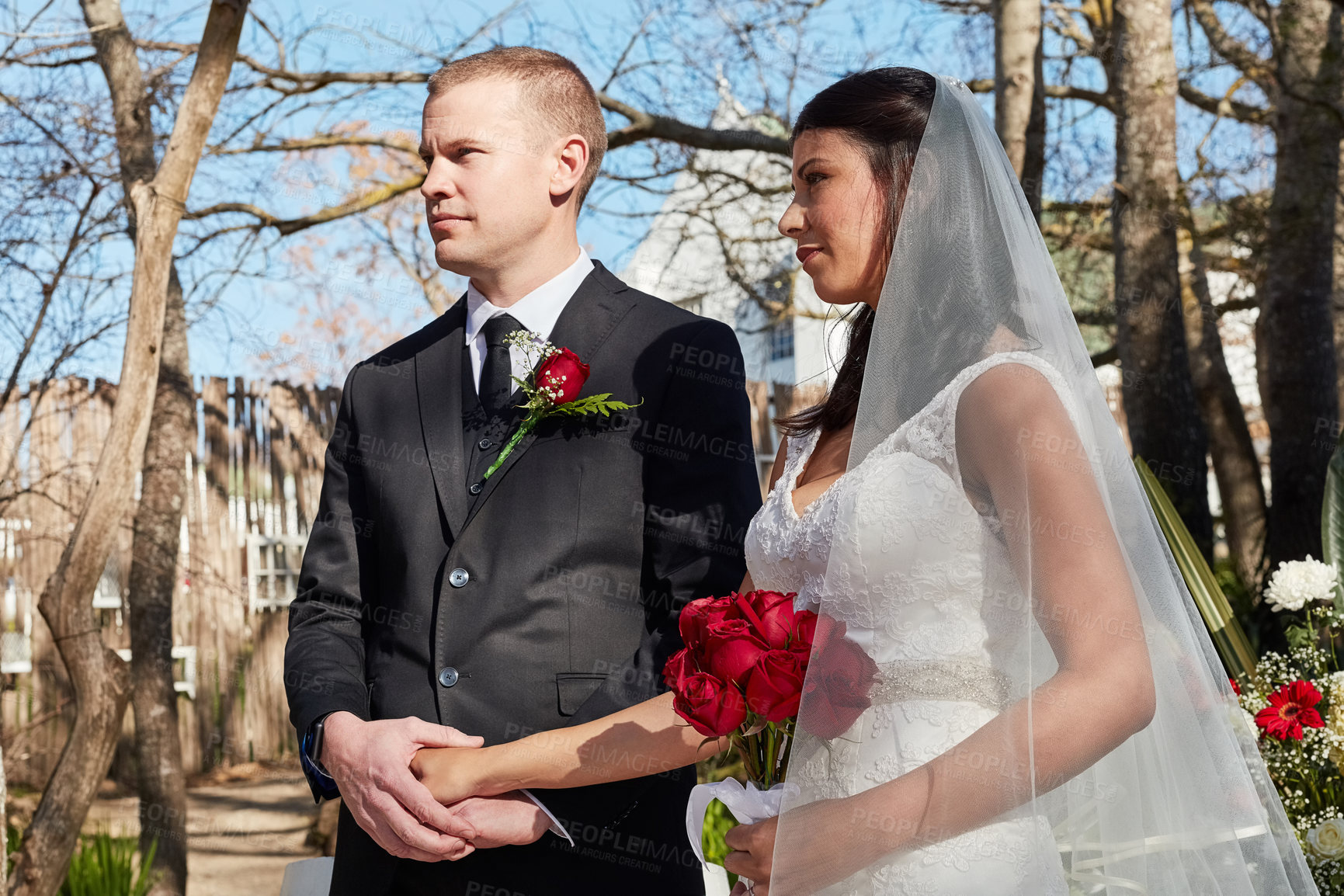 Buy stock photo Cropped shot of a bride and groom at their outdoor wedding ceremony