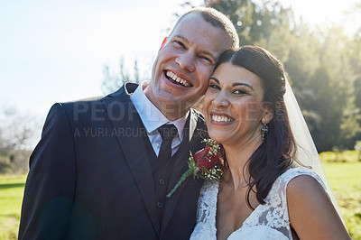 Buy stock photo Portrait of a bride and groom standing outside on their wedding day