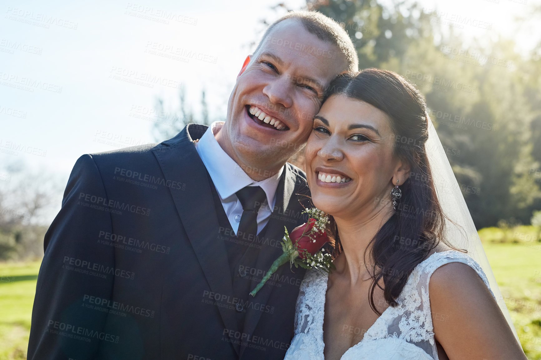 Buy stock photo Portrait of a bride and groom standing outside on their wedding day