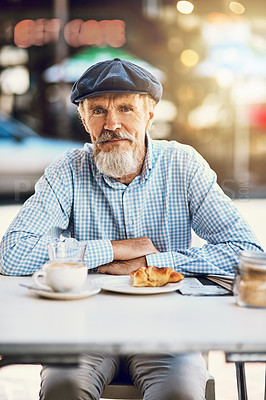 Buy stock photo Portrait of a happy senior man enjoying a cup of coffee at a sidewalk cafe