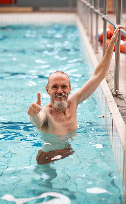 Buy stock photo Portrait of a happy senior man exercising in a swimming pool at a gym