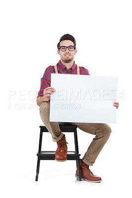 Buy stock photo Man, studio portrait and holding paper board for marketing, branding mockup and focus by white background. Young model, isolated and sitting with mock up poster, billboard and space for advertising