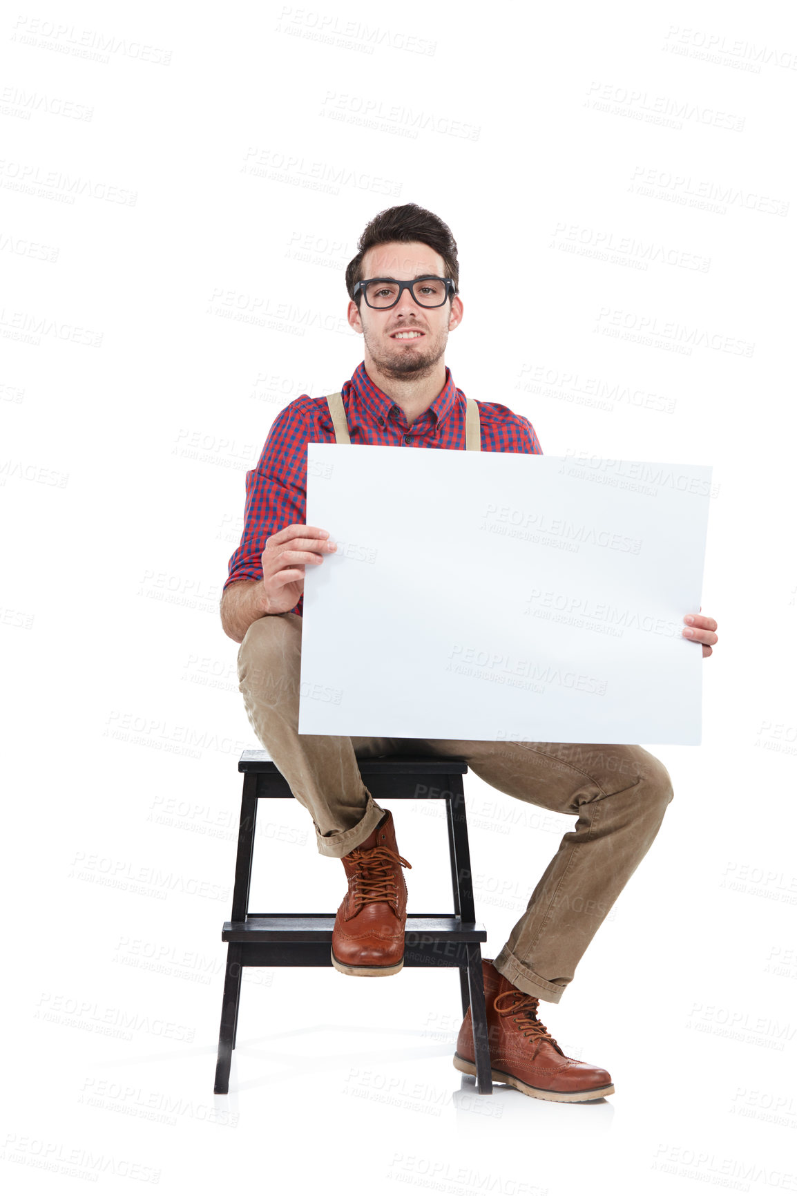 Buy stock photo Man, studio portrait and holding paper board for marketing, branding mockup and focus by white background. Young model, isolated and sitting with mock up poster, billboard and space for advertising