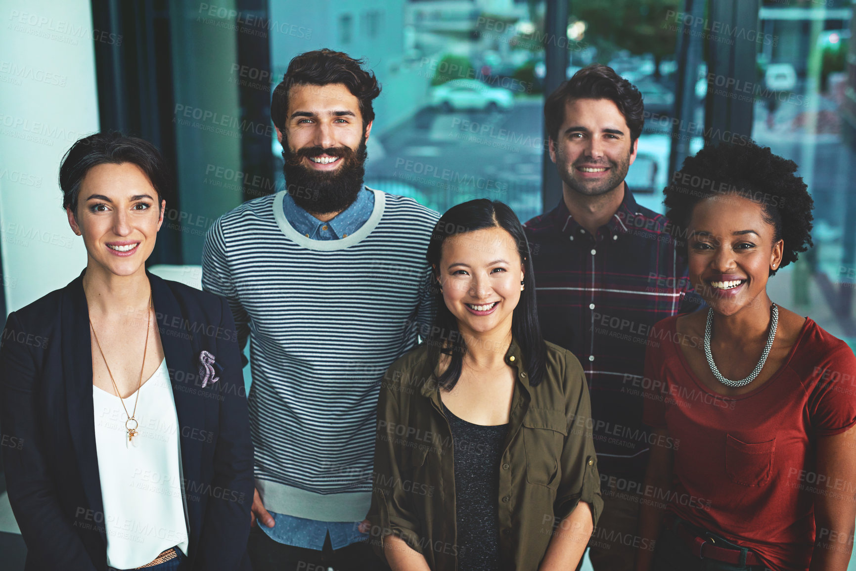 Buy stock photo Portrait of a group of diverse designers standing together in an office