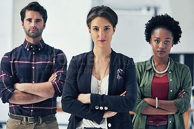 Buy stock photo Portrait of a group of businesspeople standing with their arms folded in a modern office