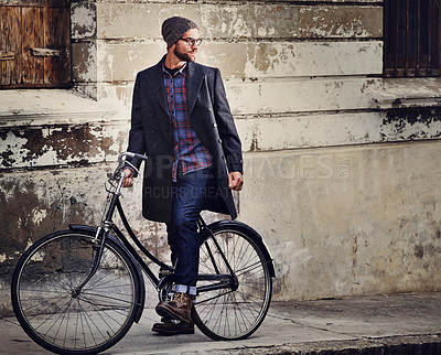 Buy stock photo Bike, fashion and man in city for travel on winter vacation, adventure or holiday with retro style. Vintage, stylish and male person on bicycle for cycling with beanie and coat for outfit in town.