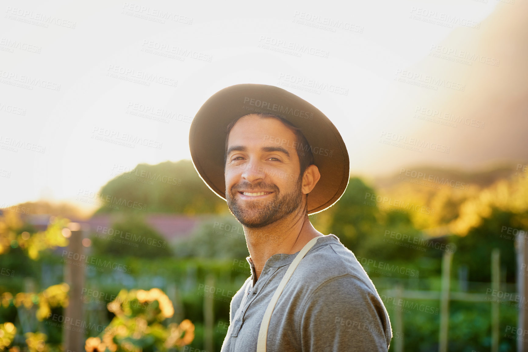 Buy stock photo Portrait of a happy young man working on a farm