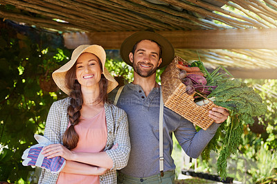Buy stock photo Portrait of a happy couple working together in a vegetable garden