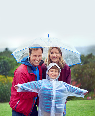 Buy stock photo Portrait, family and happy portrait in rain with umbrella outdoor in nature for fun, happiness and quality time. Man, woman and excited child together for water drops, playing and freedom with mockup