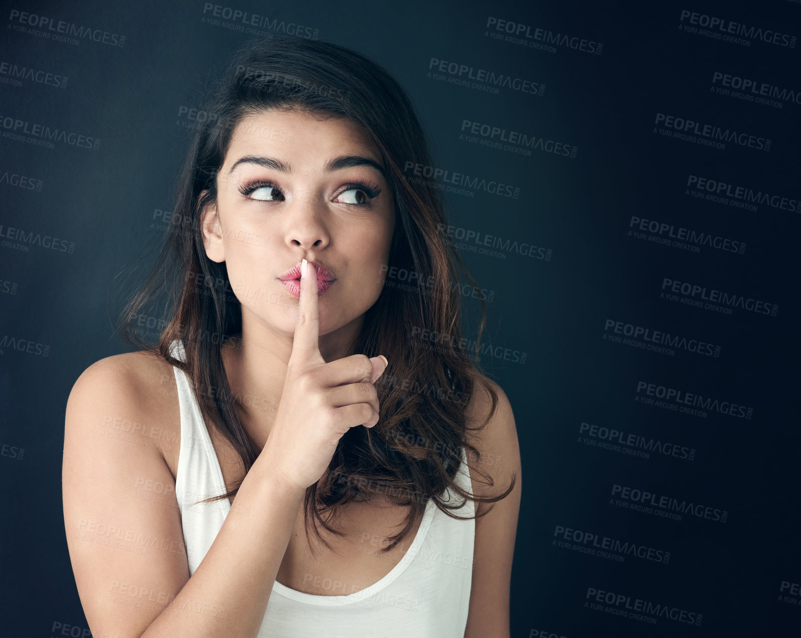 Buy stock photo Woman, secret and thinking with lips on finger for whisper, gossip or silence on a dark studio background. Female person or model in wonder or thought for hush, shush or confidential information