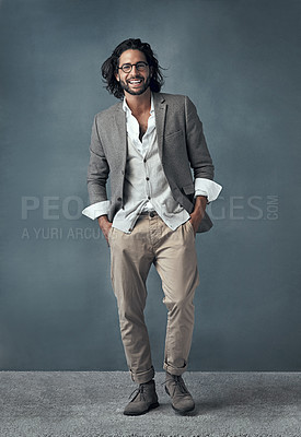 Buy stock photo Full length studio portrait of a handsome and stylish young man against a grey background