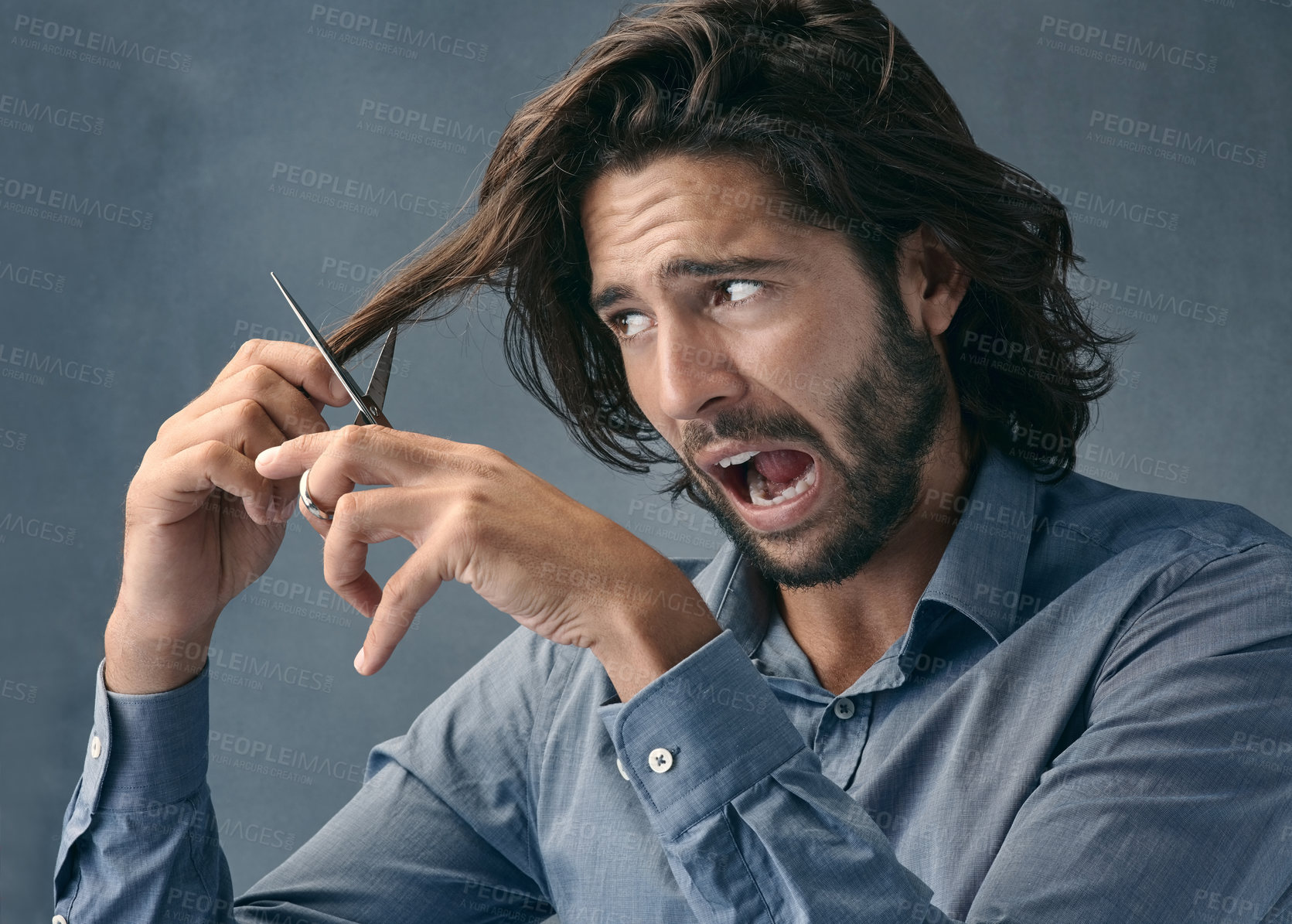 Buy stock photo Trimming, hair and scared man with scissors for grooming, facial cleaning and mistake on grey studio background. Barber, fail and face of fear model cutting hair for comedy cosmetic beauty look