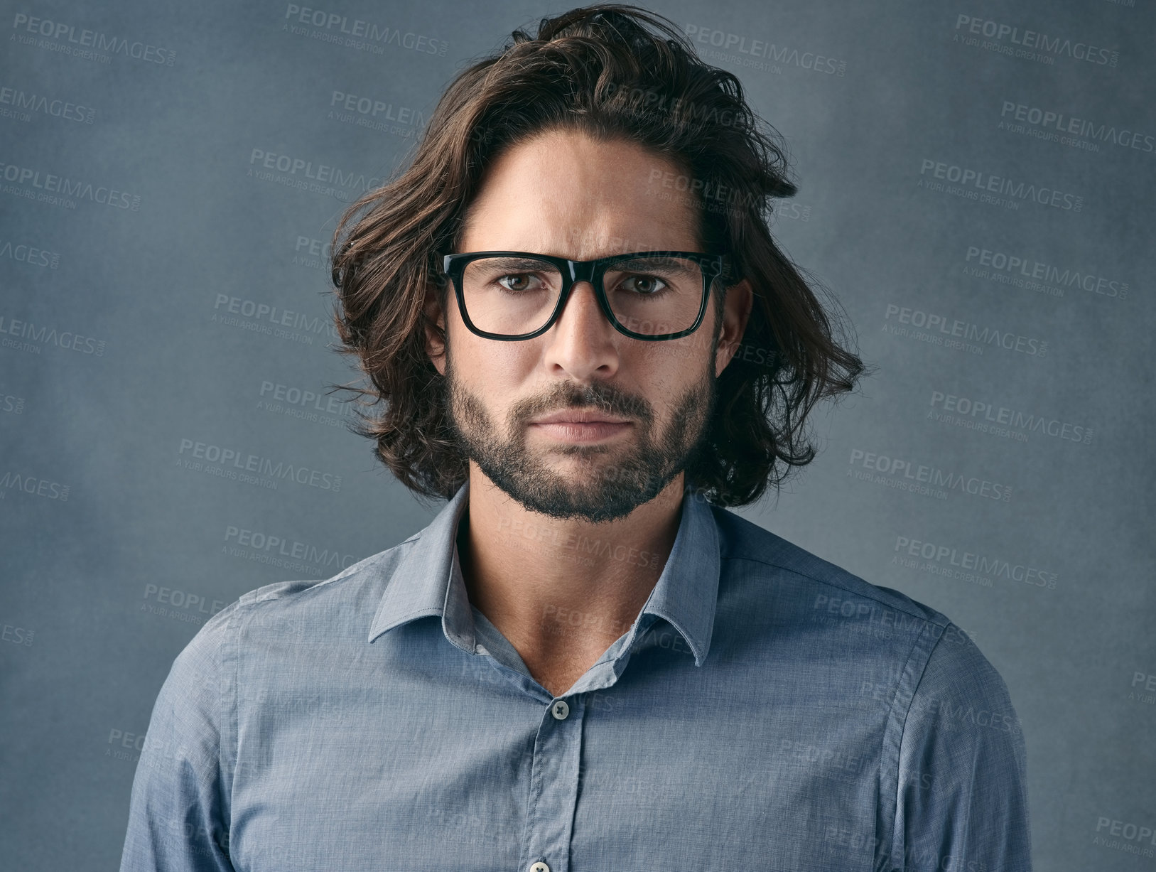 Buy stock photo Glasses, portrait or serious and business man in studio on gray background with mean or tough expression. Eyewear, face and vision with assertive employee in shirt for professional job or work