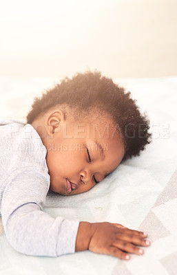 Buy stock photo Cute, bed and baby sleeping in home on blanket for rest, nap time and dreaming in nursery. Childcare, newborn and adorable, tired and African child in bedroom sleep for comfort, relaxing and calm