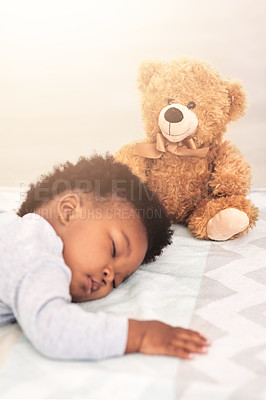 Buy stock photo Sleeping, teddy bear and tired with baby in bedroom for carefree, development and innocence. Dreaming, relax and comfortable with african infant and toy at home for morning, resting and bedtime