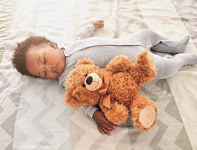 Buy stock photo Sleeping, teddy bear and nap with baby in bedroom for tired, development and innocence. Dreaming, relax and comfortable with african infant and toy at home for morning, resting and bedtime