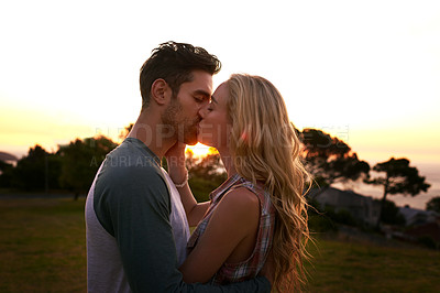 Buy stock photo Cropped shot of an affectionate young couple outdoors