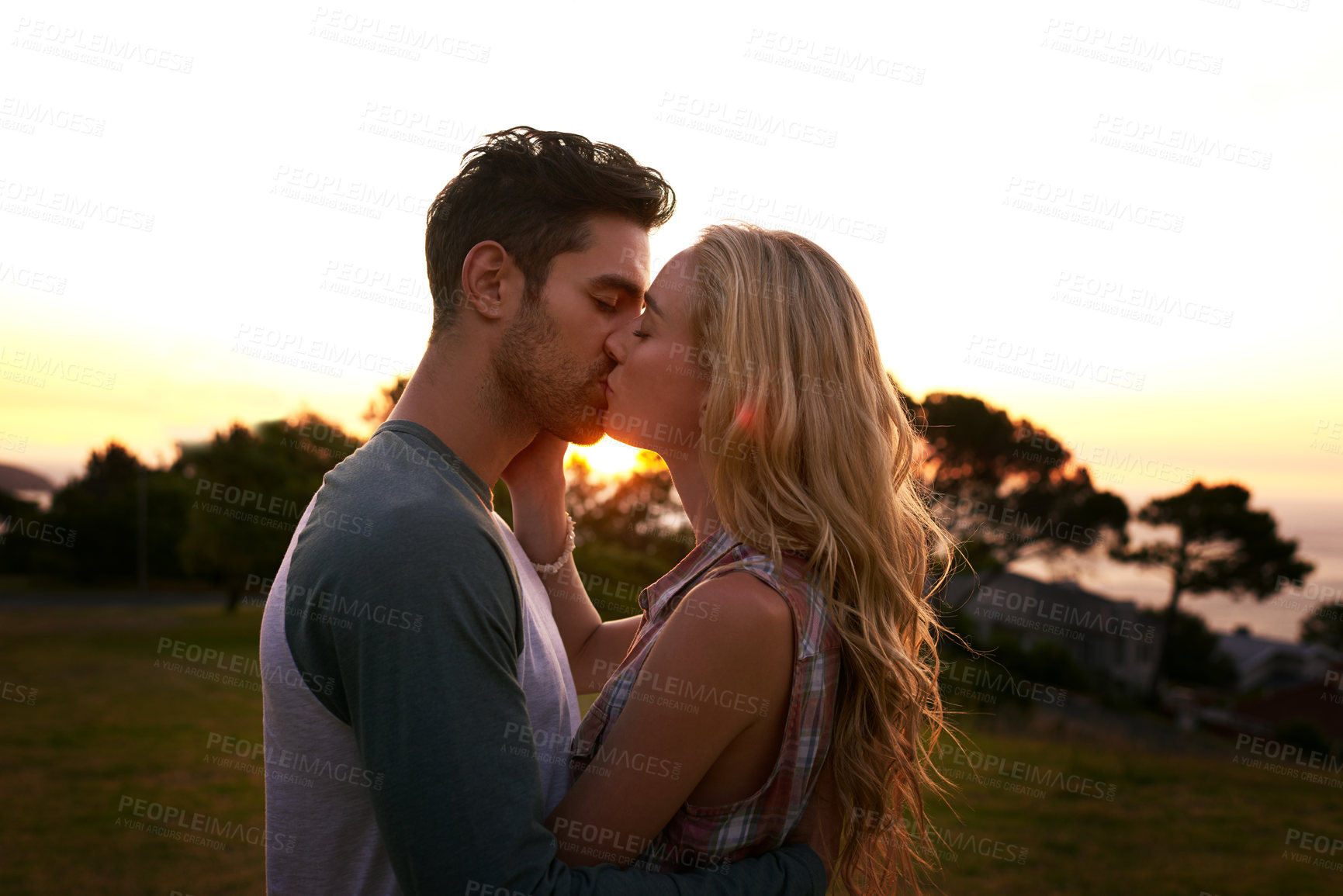 Buy stock photo Cropped shot of an affectionate young couple outdoors