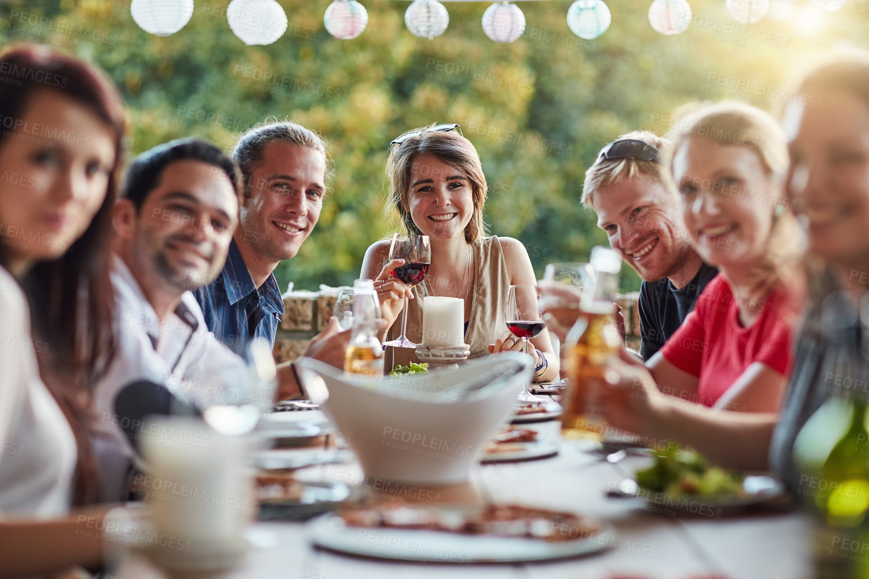 Buy stock photo Friends, portrait and dinner party with happy, celebration and young people together with drinks. Holiday, home and outdoor gathering with alcohol, friendship and food at social event with smile