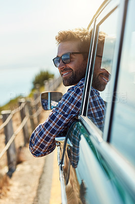 Buy stock photo Road trip, travel and man relax in car driving for adventure, summer vacation and holiday. Transportation, window and face of male person in motor vehicle for freedom, journey and happy on mountain