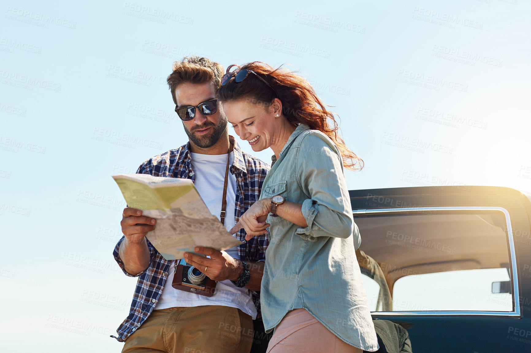 Buy stock photo Road trip, couple and map outdoor for search, location navigation and destination for travel. Happy people, man and woman with paper for guidance, direction and instructions for adventure journey