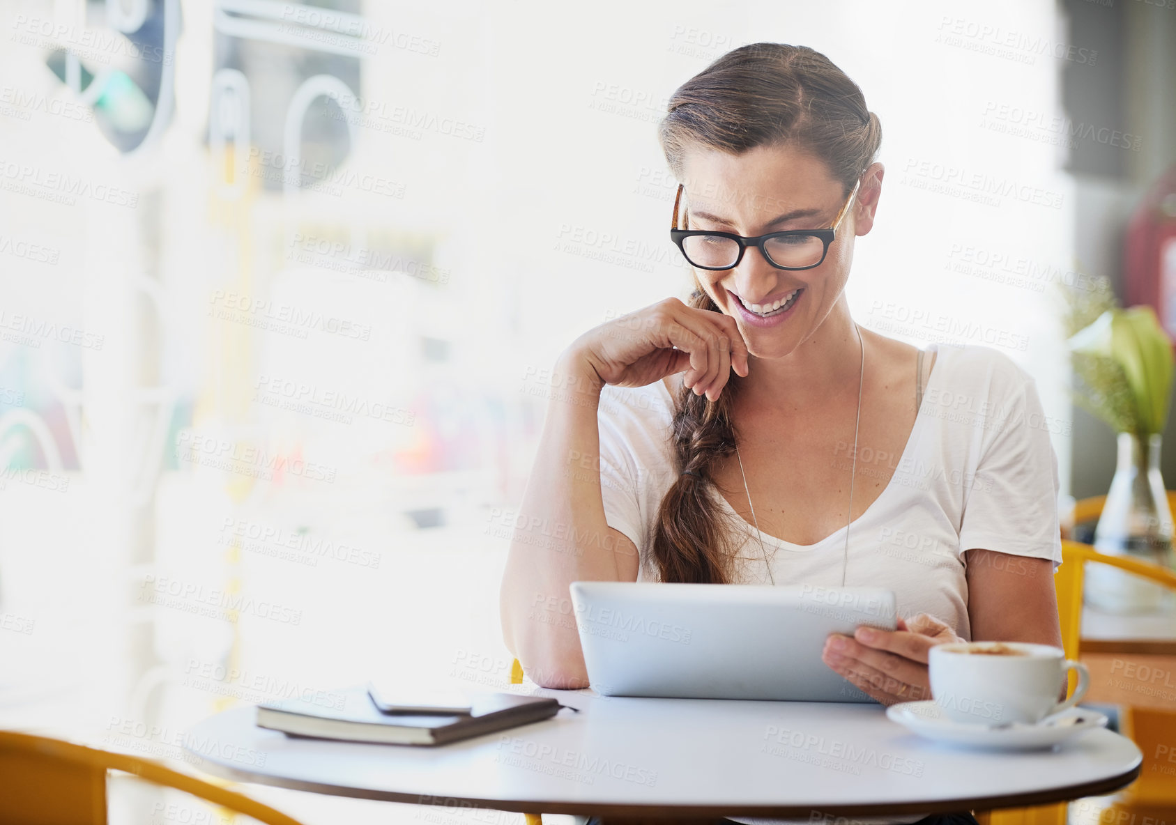 Buy stock photo Happy, woman and relax with tablet in coffee shop for social media, entertainment and comedy shows to unwind. Female person, free time and laughing for online meme, comic video and browsing internet.