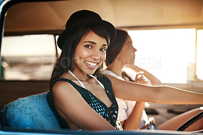 Buy stock photo Portrait of a happy young woman enjoying a road trip with her friend