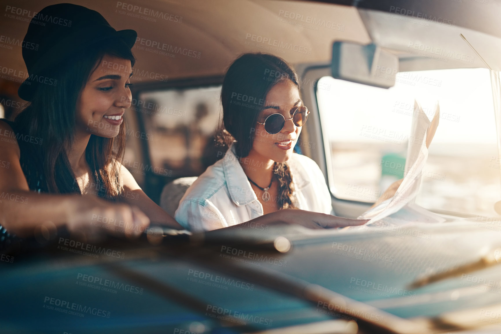 Buy stock photo Women, friends and drive on car with map for direction, route and navigate on road trip in Brazil. People, tourist and happy with location or destination for traveling, adventure and summer holiday