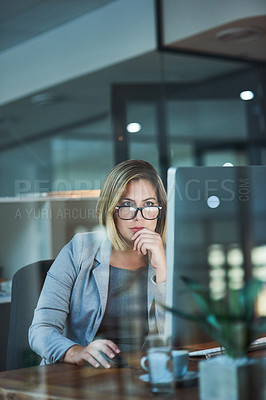 Buy stock photo Cropped shot of a businesswoman working late at night in her office