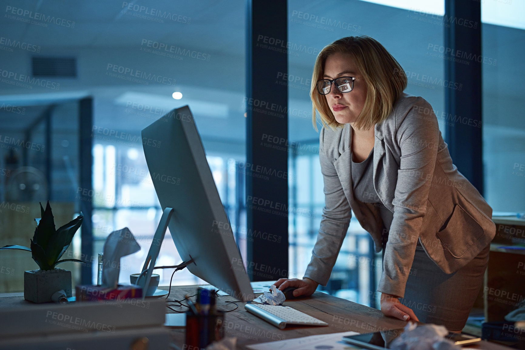 Buy stock photo Cropped shot of a businesswoman working late at night in her office