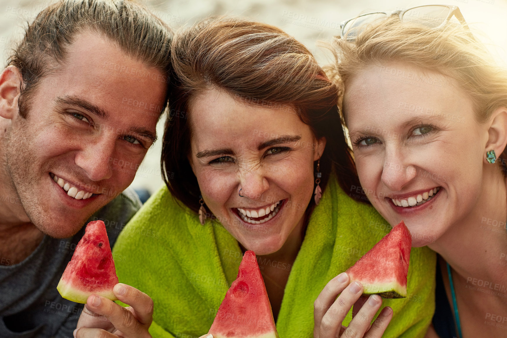 Buy stock photo Group, eating watermelon and portrait for together, picnic and social by beach on holiday, vacation and travel. People, fruit and friends in summer for wellness, outdoor adventure and ocean in Greece