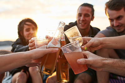 Buy stock photo Beer, hands and toast with friends on beach together for holiday, party or travel at sunset. Alcohol, celebration and cheers with group of people outdoor on coast for bonding or island vacation