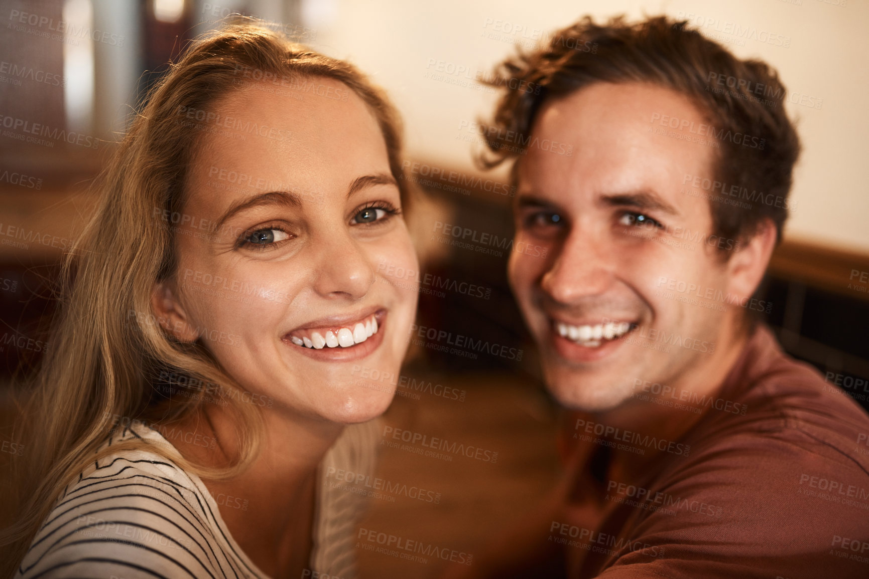 Buy stock photo Portrait of a happy young couple spending time together at a cafe