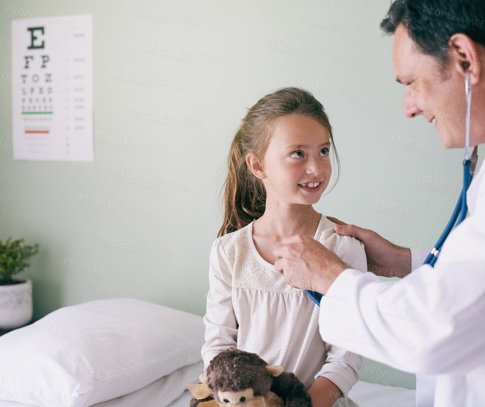 Buy stock photo Healthcare, kids and a girl at a man pediatrician for an appointment or checkup in the hospital. Medical, stethoscope and heart with an adorable little female child sitting on a bed in the clinic