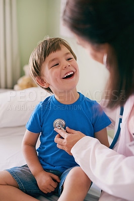 Buy stock photo Doctor, stethoscope and child in hospital for healthcare, health and wellness with medical exam. Female pediatrician, consulting and patient in clinic for heart, lung or cardiology with down syndrome