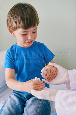 Buy stock photo Boy, child and holding hands with doctor, happy and care with medical service, check and exam on clinic bed. Woman, pediatrician and kid with smile, playful and connection for healthcare at hospital