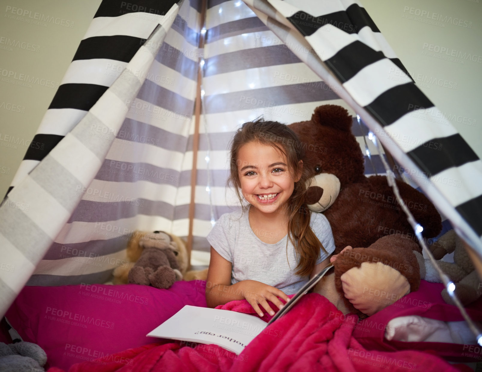 Buy stock photo Portrait, happy child and reading book in home tent for education, development or creative knowledge in bedroom. Face, girl and studying fantasy story, information or hobby with teddy bear in house