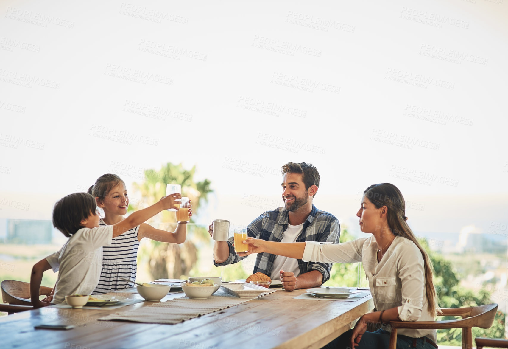 Buy stock photo Shot of a family having breakfast together at home