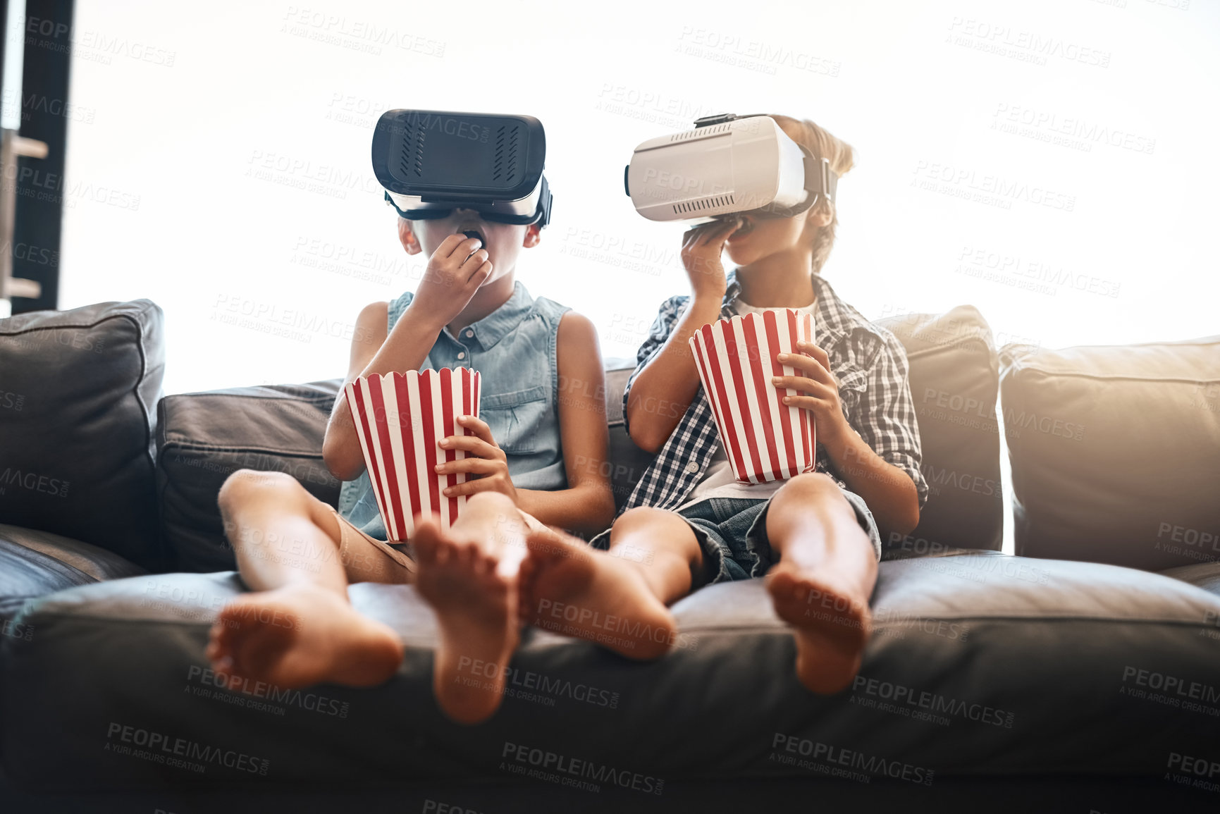 Buy stock photo Children, popcorn and virtual reality headset in home of cyber experience, metaverse system or gaming connection. 
Siblings, VR and movie in living room for future, digital world and ui video tech