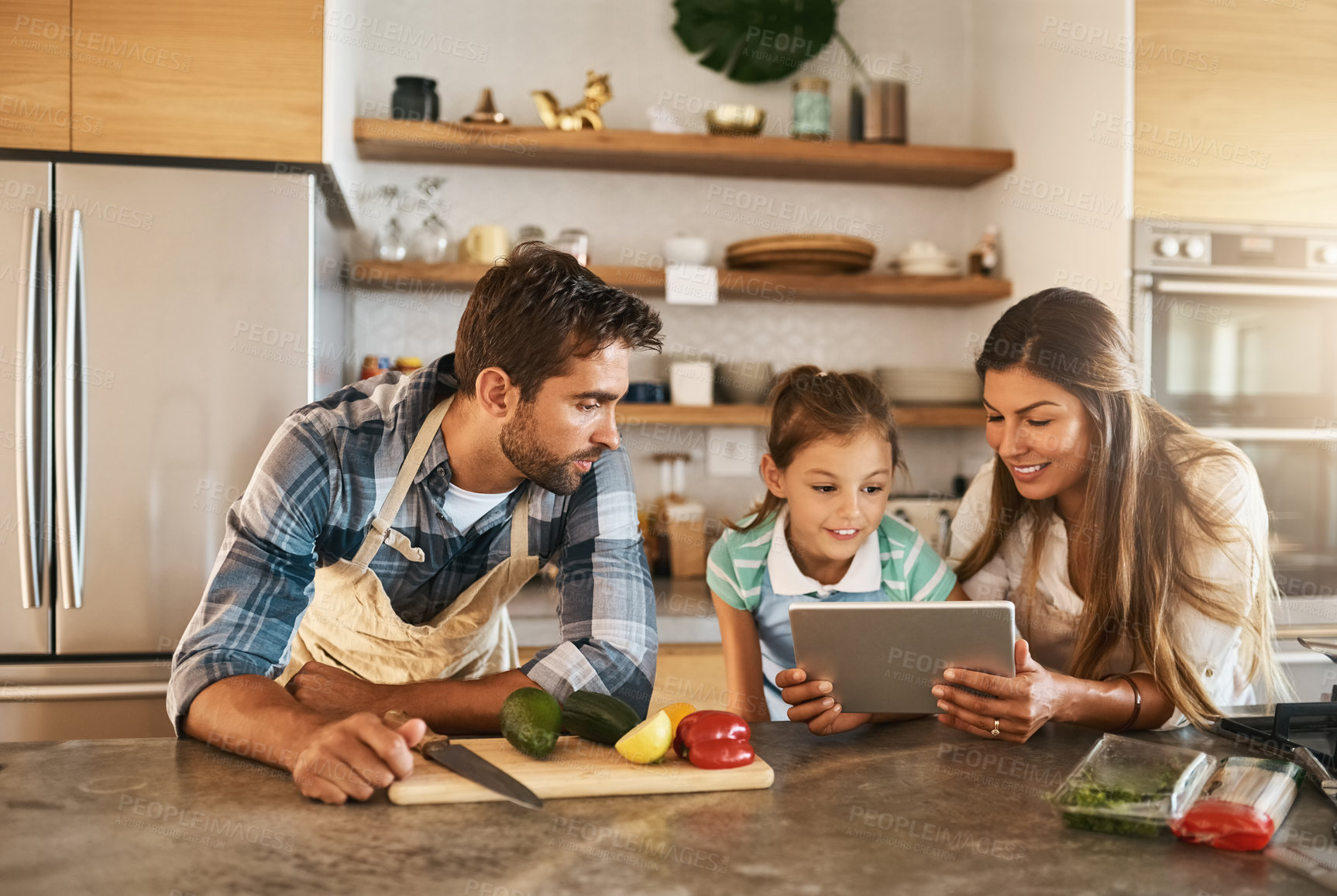 Buy stock photo Food, nutrition and diet with people, tablet and ingredients for salad recipe on kitchen counter for dinner. Family, healthy and meal prep with with avocado, pepper and pasta for clean eating in home