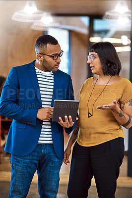 Buy stock photo Tablet, team or business people talking in office with ideas, internet and diversity. A professional man and woman together for a creative project using online app for discussion, strategy or advice