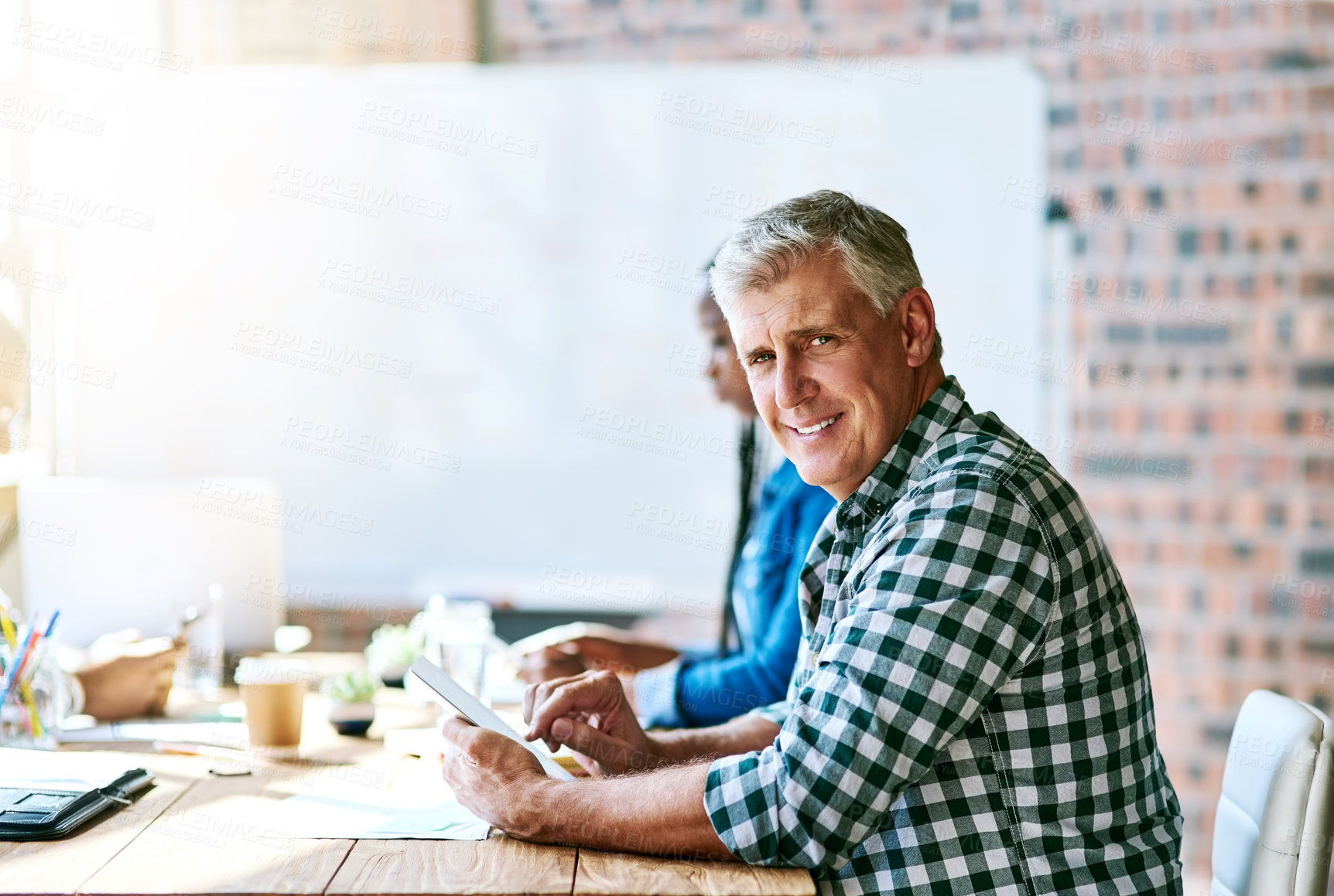 Buy stock photo Portrait, tablet and mature man in meeting for creative project management, planning or workshop. Confidence, digital app and businessman at design startup for growth, presentation or smile in office